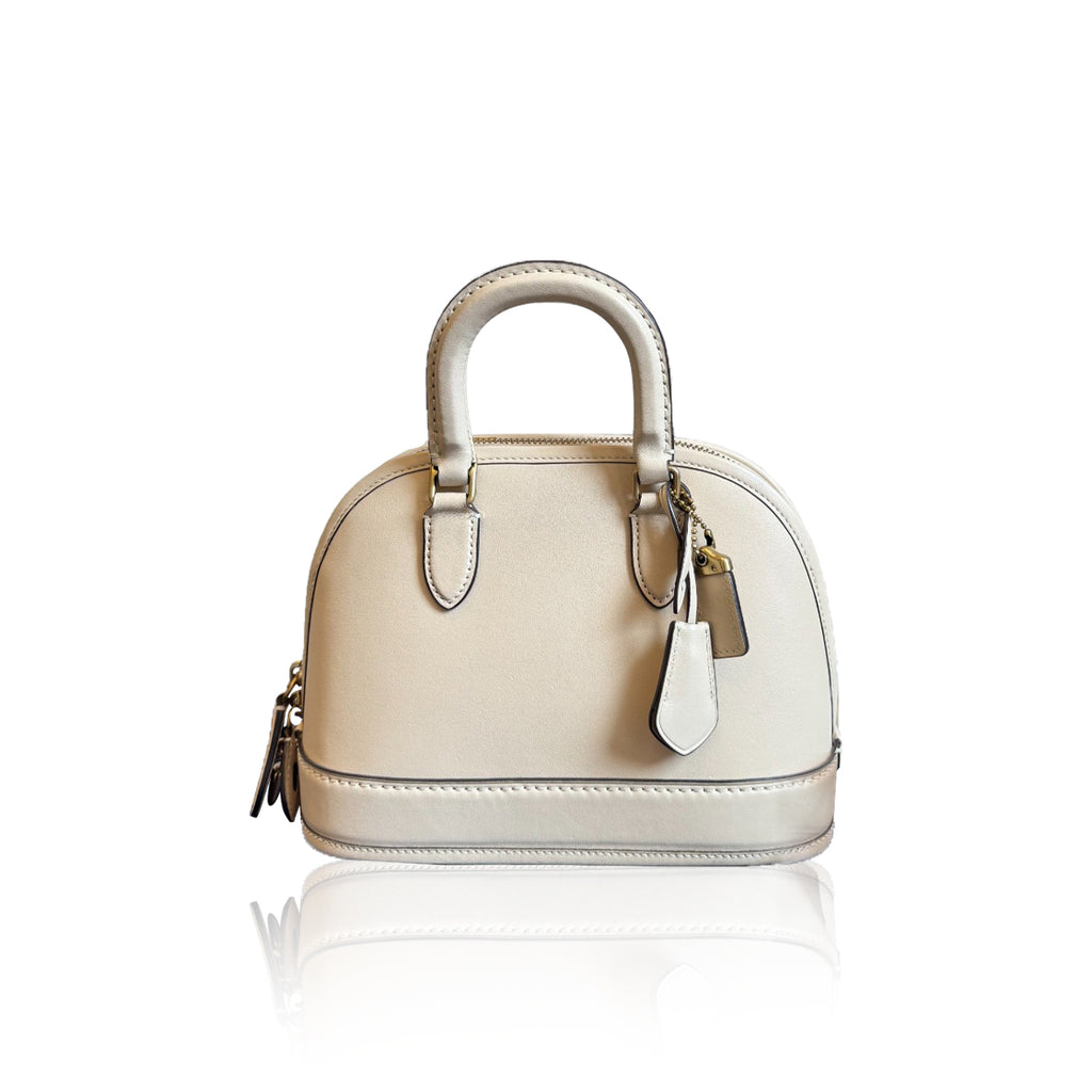 Coach Reveal Alma