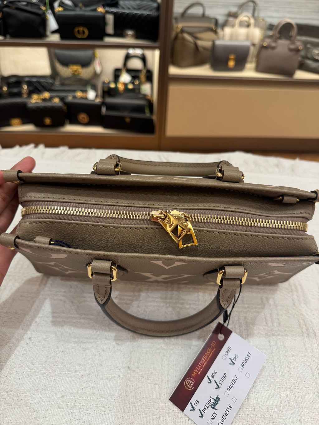 Louis Vuitton On The Go East West Bicolor Monogram Empriante