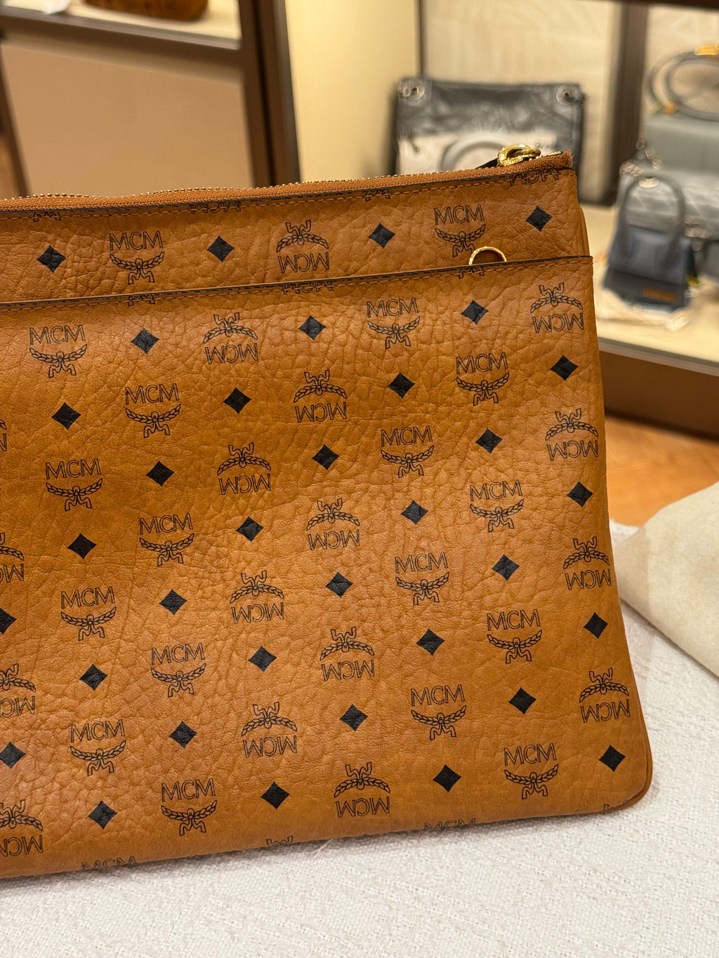 MCM Clutch Sling Cognac
