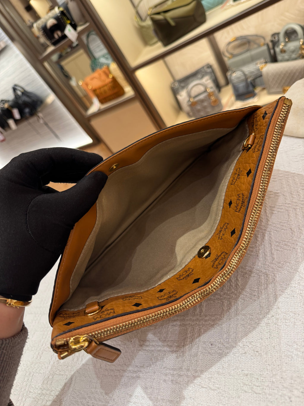 MCM Clutch Sling Cognac