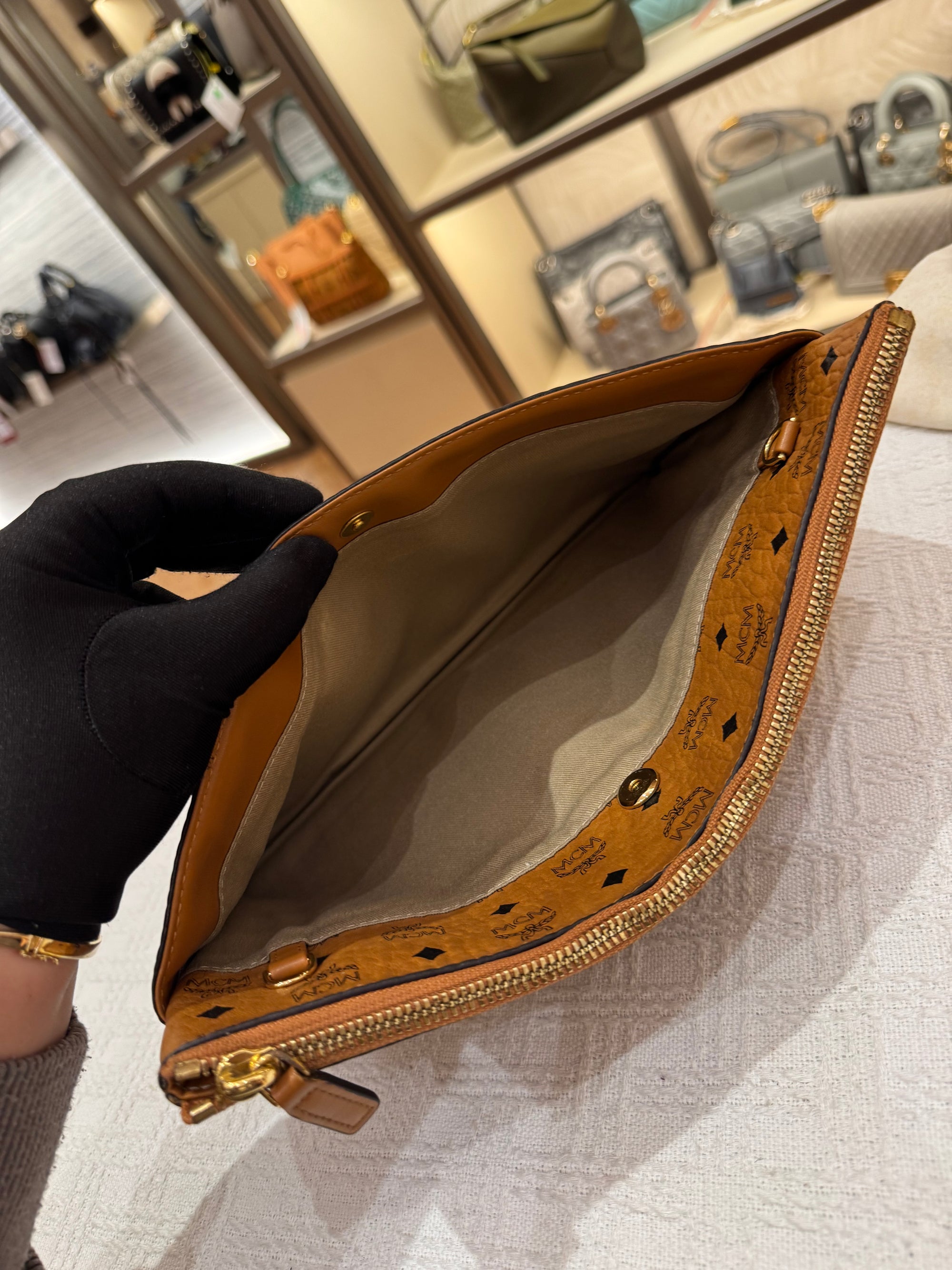 MCM Clutch Sling Cognac