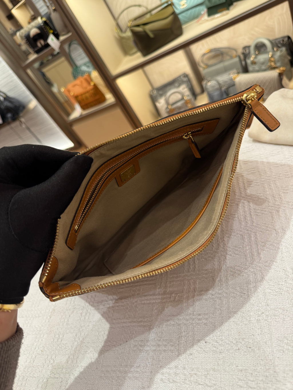 MCM Clutch Sling Cognac