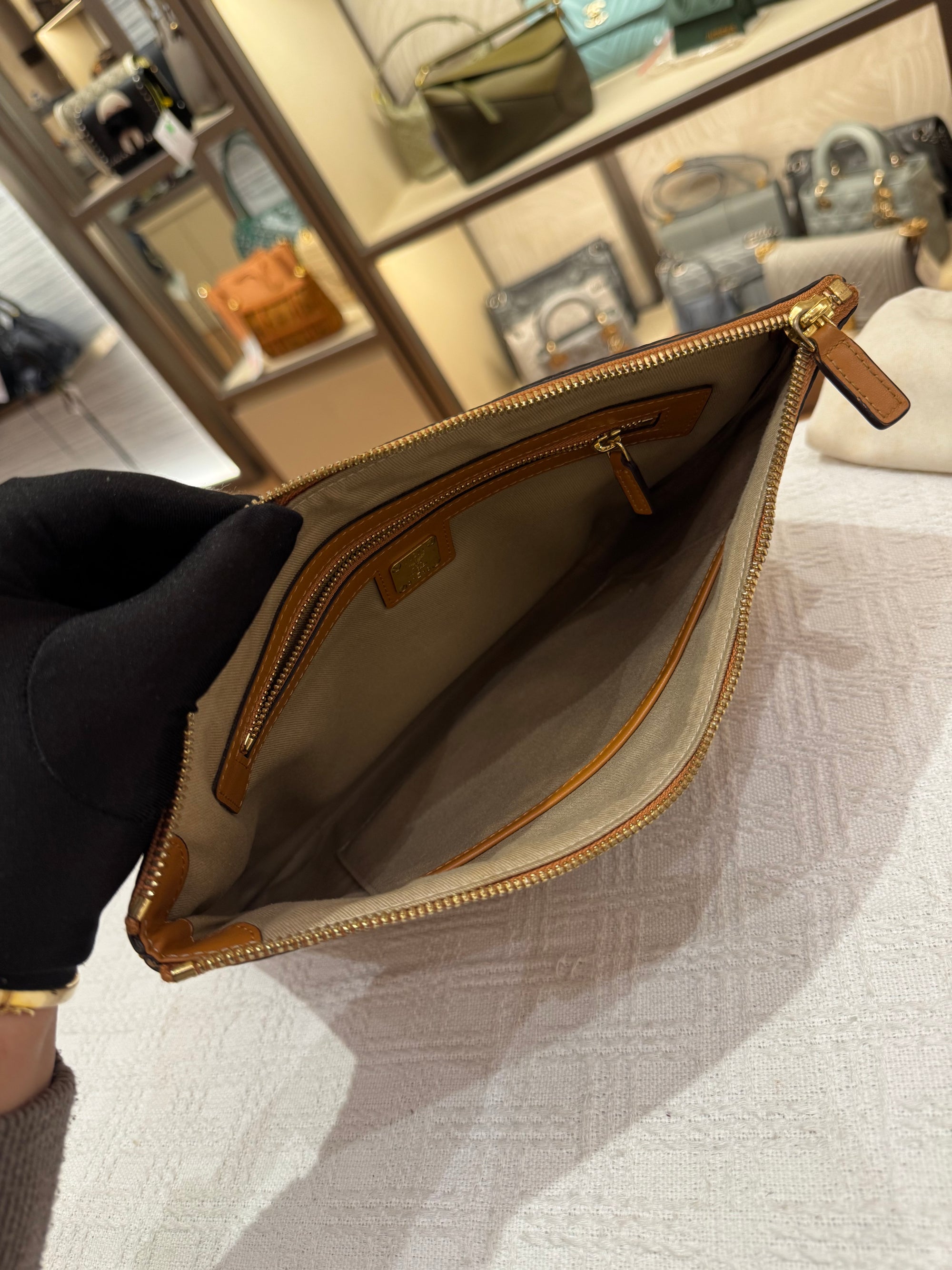 MCM Clutch Sling Cognac